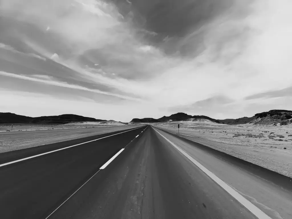 An empty desert highway near Tabuk, in black and white
