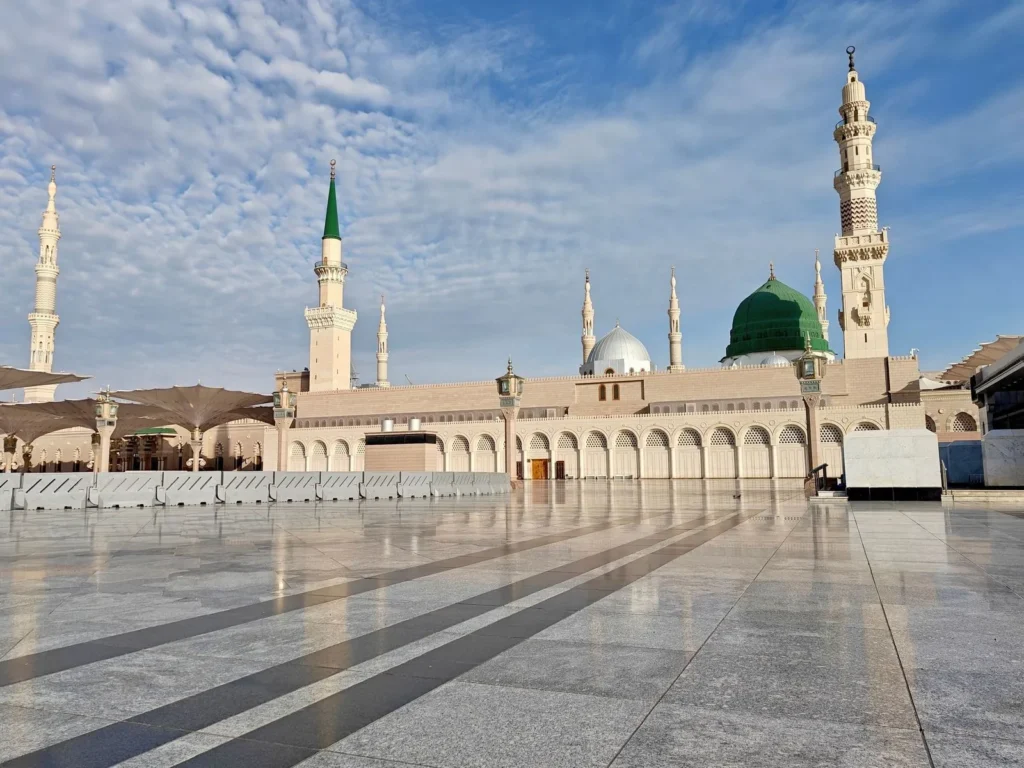 The empty marble courtyard of Masjid an-Nabawi with the Green Dome