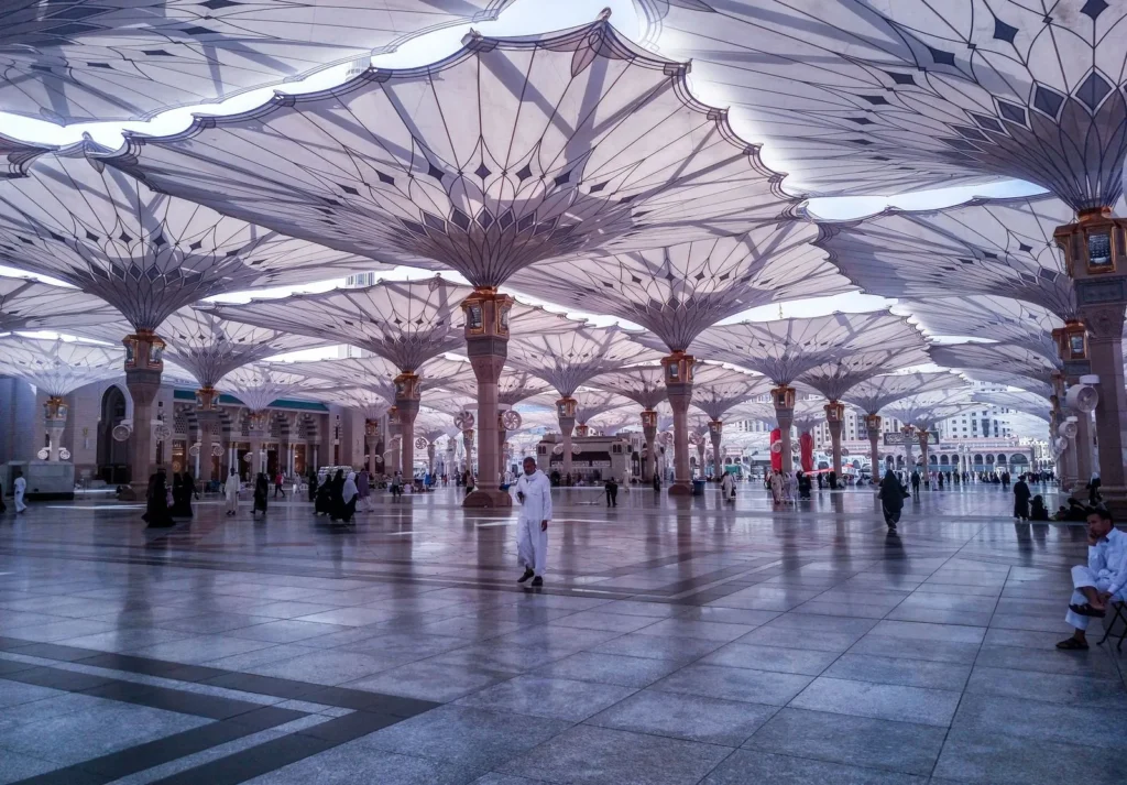 Open umbrellas over the courtyard of Masjid an-Nabawi