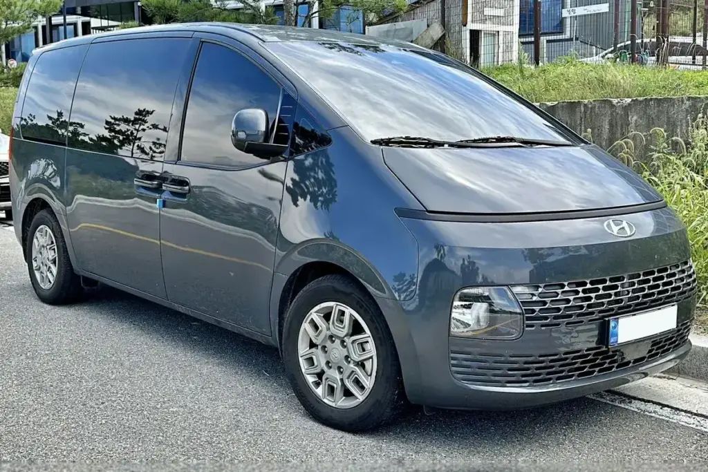 A grey Hyundai Staria, front three quarter view