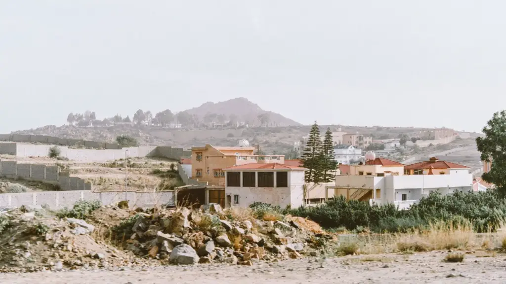 Houses below a rocky hill in Taif