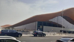Terminal 1 of King Abdulaziz International Airport, Jeddah, from the kerbside, with SUVs at the drop off lane