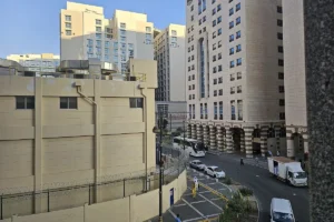 Hotel blocks and a street with a coach in central Madinah near the Haram