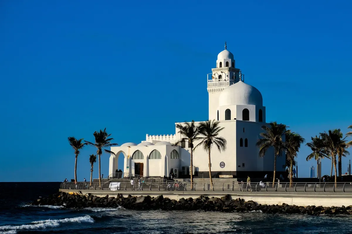 Al Rahmah Mosque (the floating mosque) on the Jeddah Corniche under a deep blue sky