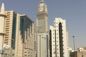 Makkah Clock Royal Tower rising behind hotel buildings near the Haram