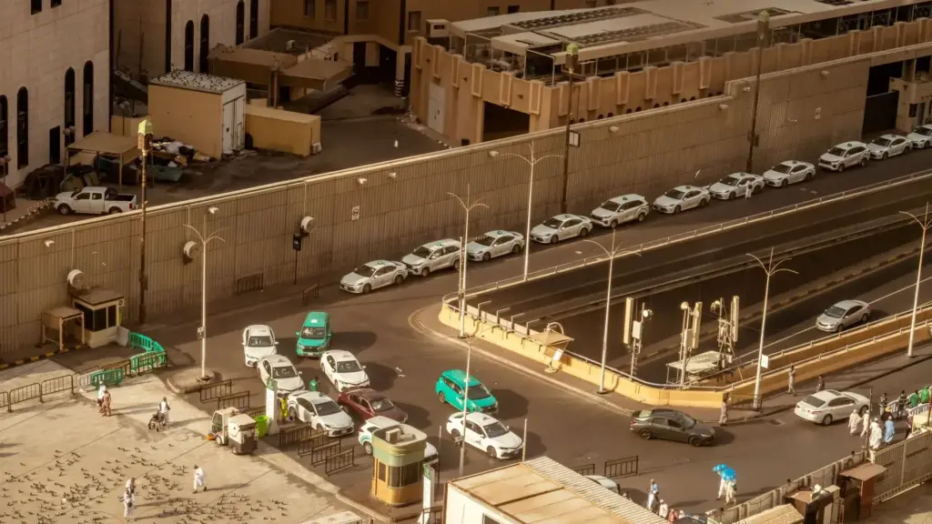 Street, car park and taxis next to the Haram in Makkah, seen from above