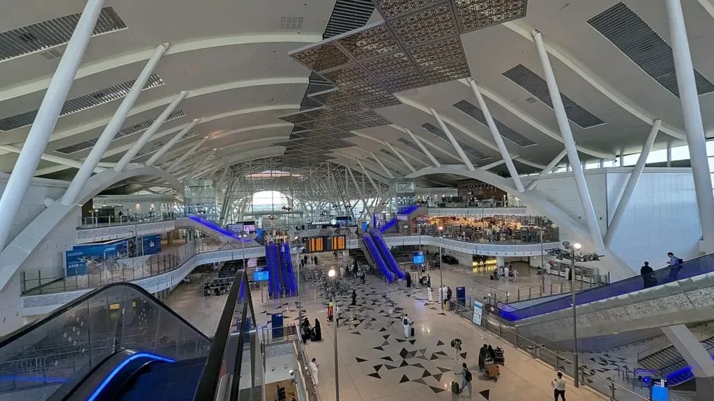 Inside the Haramain railway station at King Abdulaziz International Airport, Jeddah, with escalators and the main hall