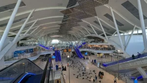 Inside the Haramain railway station at King Abdulaziz International Airport, Jeddah, with escalators and the main hall