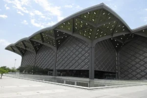 Madinah station of the Haramain High Speed Railway from outside, with its tree shaped canopy roof