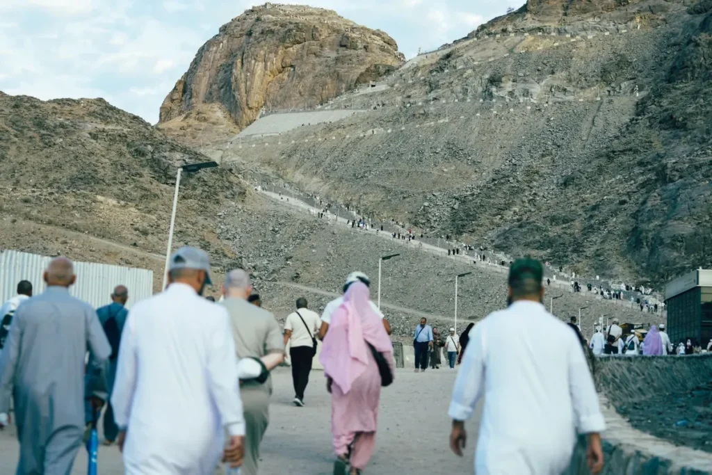 Pilgrims seen from behind on the path up Jabal al-Nour, Makkah