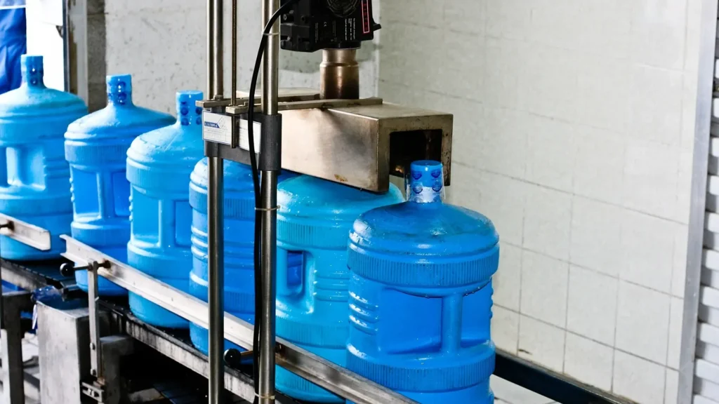 Zamzam water containers on a filling line