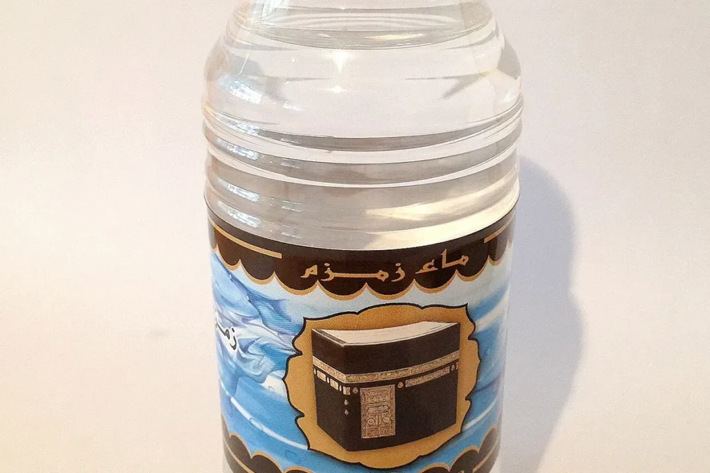 Small plastic bottle labelled Zamzam water, close up