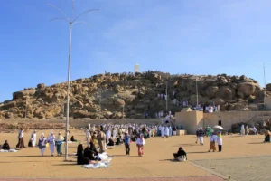 Visitors on the open square below Jabal al-Rahmah, the pillar on the hilltop