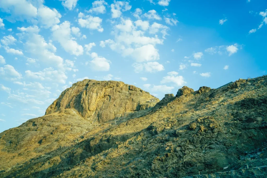 The rocky summit of Jabal al-Nour in Makkah under a blue sky with scattered cloud
