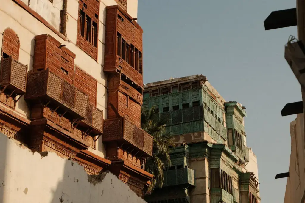 Red and green wooden balconies on historic houses in Al Balad, Jeddah