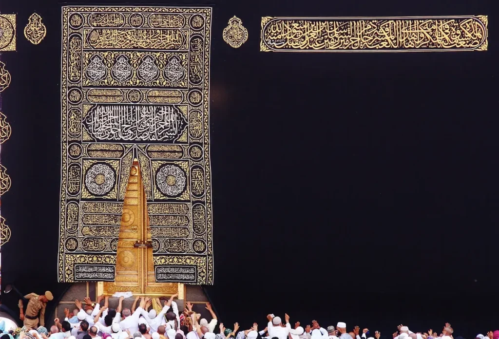 The black and gold kiswa covering the Kaaba around its door, the cloth woven at the Kiswa complex in Makkah
