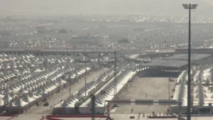 An open road between the fireproof white tents of Mina