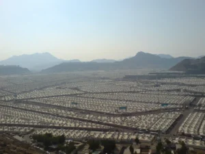 An overview of the Mina valley covered with white tents