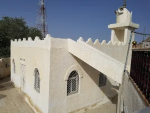 Masjid Addas in Taif, a small white mosque with a short minaret
